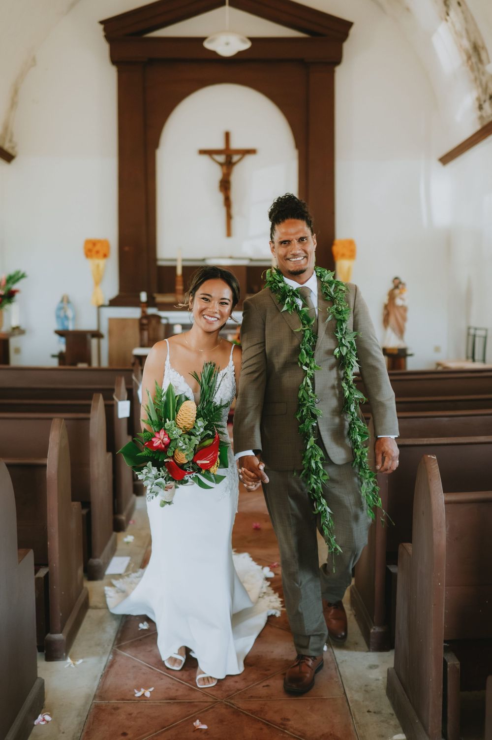 Joyful wedding ceremony moments captured inside traditional church with wooden details.