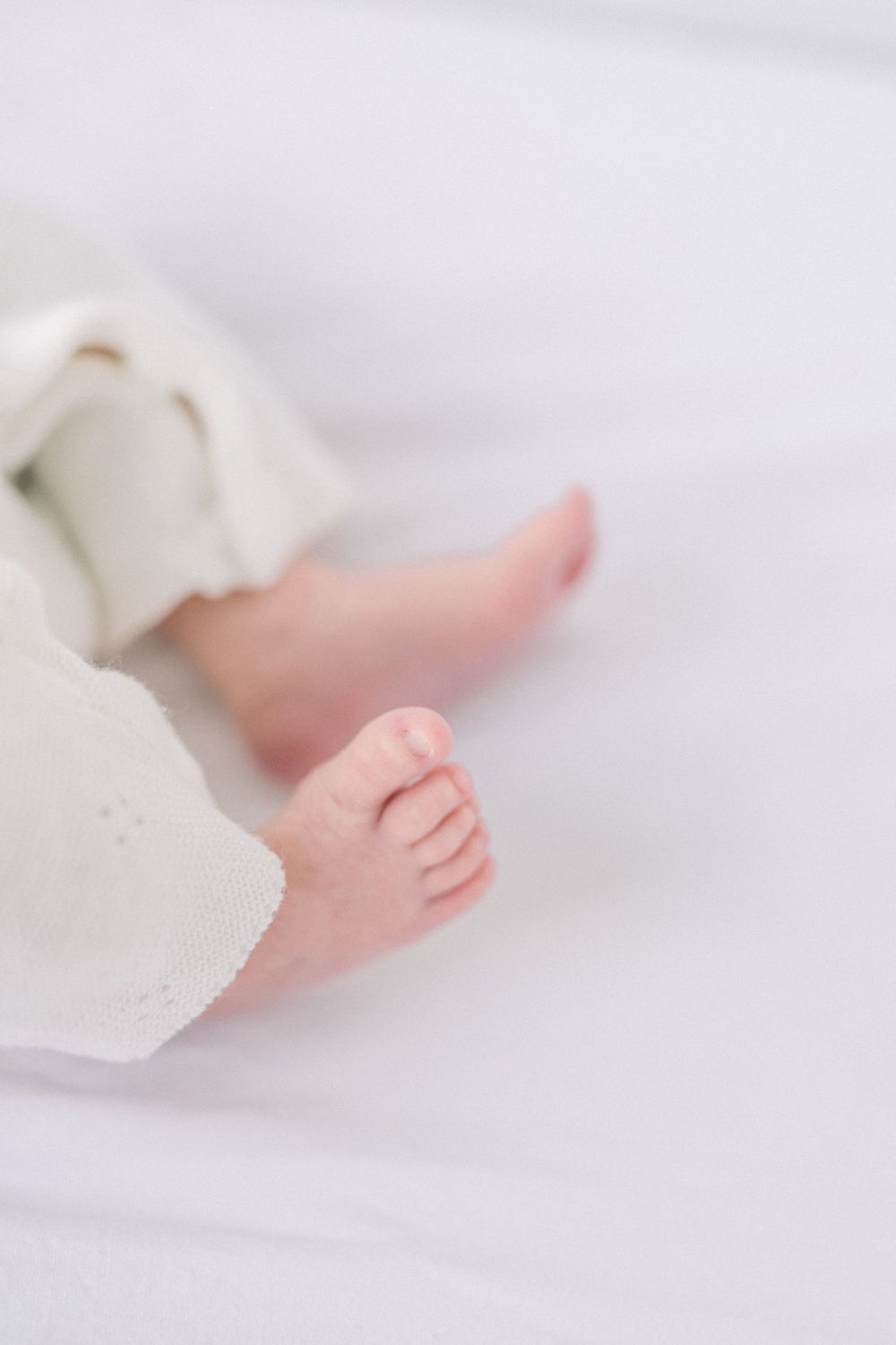 baby feet on white background taken by a DC Newborn Photographer
