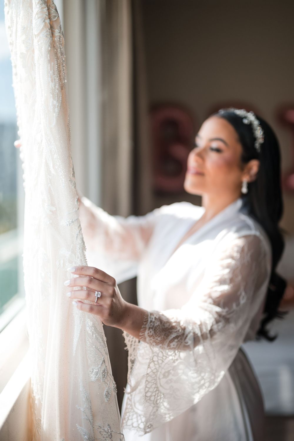Bride sitting and reading letter during emotional wedding preparation moment