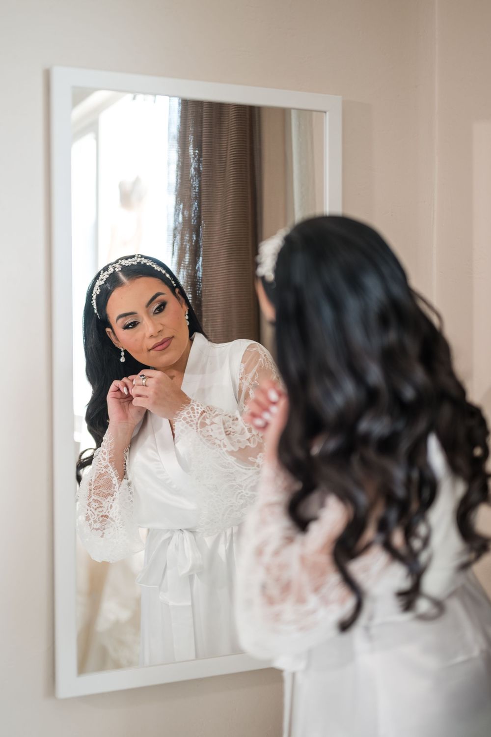Bride smiling in mirror during wedding preparation in Puerto Rico