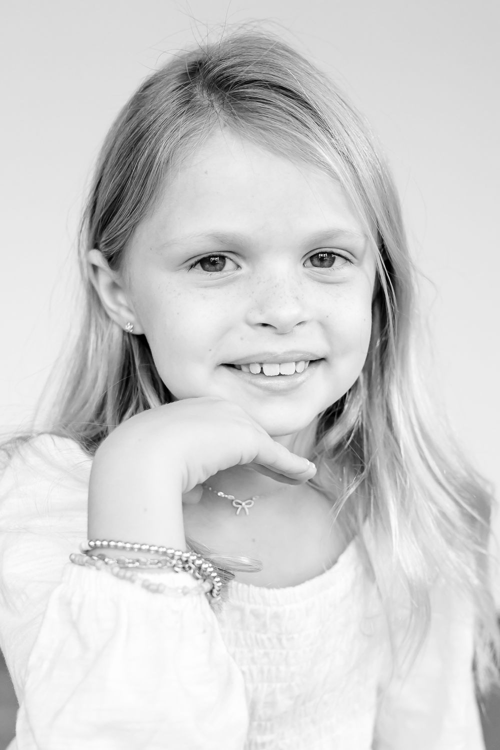 Child sitting for a fun, guided mini portrait at I Just Am Studio during Kindness Month