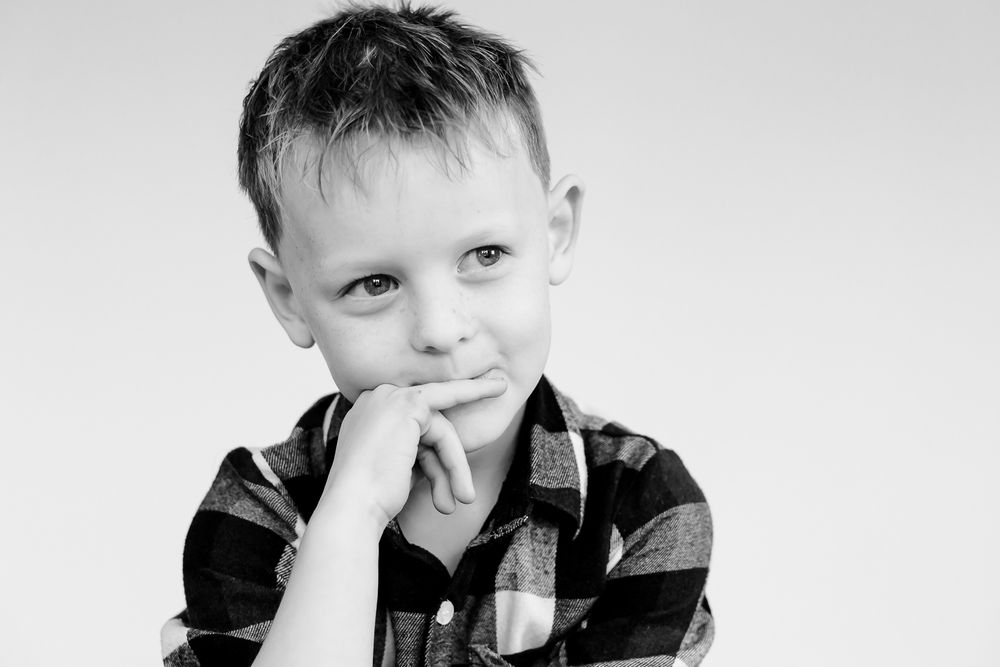 Playful kids personality portrait in black and white by Chicago photographer