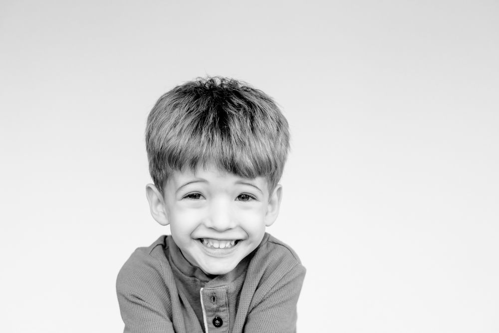 Black and white family children portrait in a bright Chicago studio