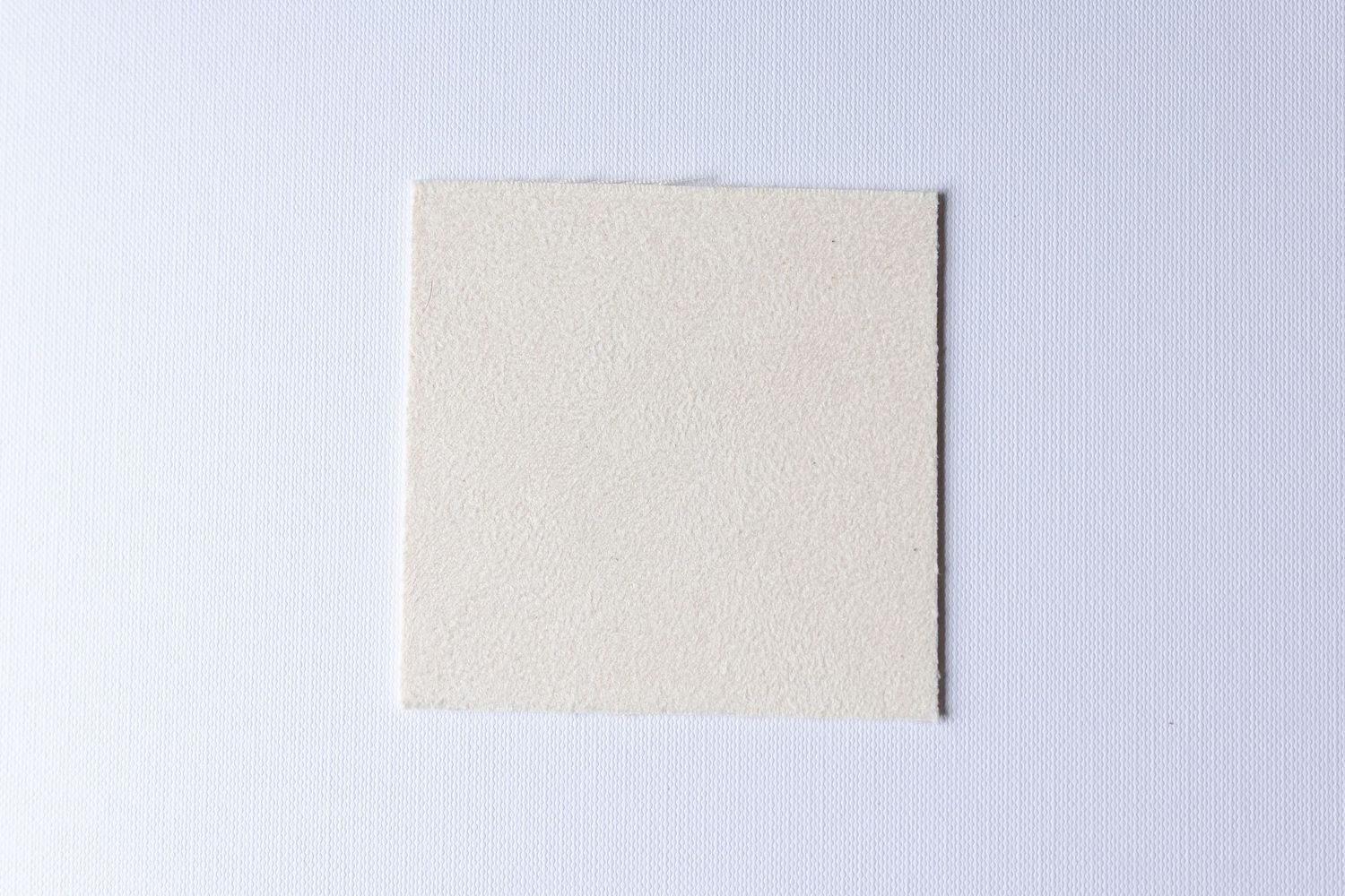 A series of five dark blue rectangular fabric swatches arranged in a horizontal row against a light background.
