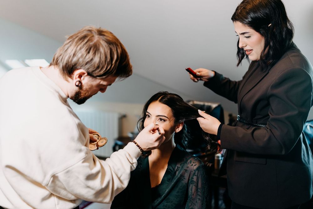 Professional hairstylist works on styling client's hair in modern salon setting.