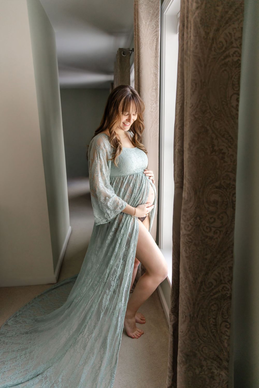 A series of artistic photos showing someone in a flowing mint green dress posed against a wall in soft lighting.