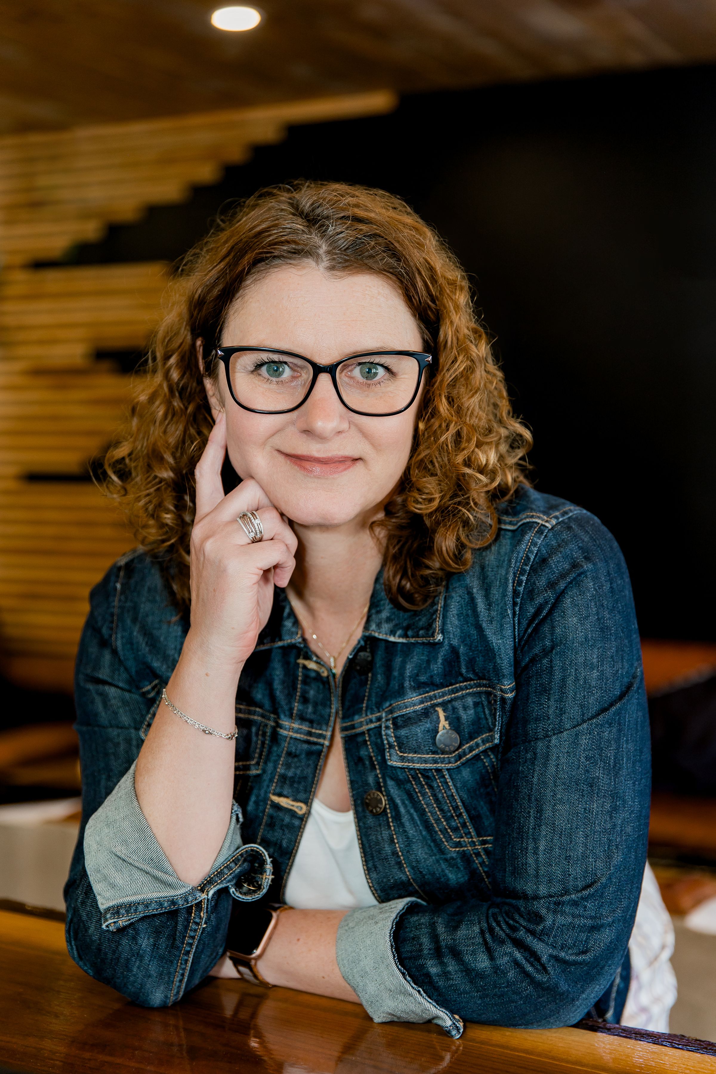 Series of casual portraits showing someone in a denim jacket and glasses in warm indoor lighting.