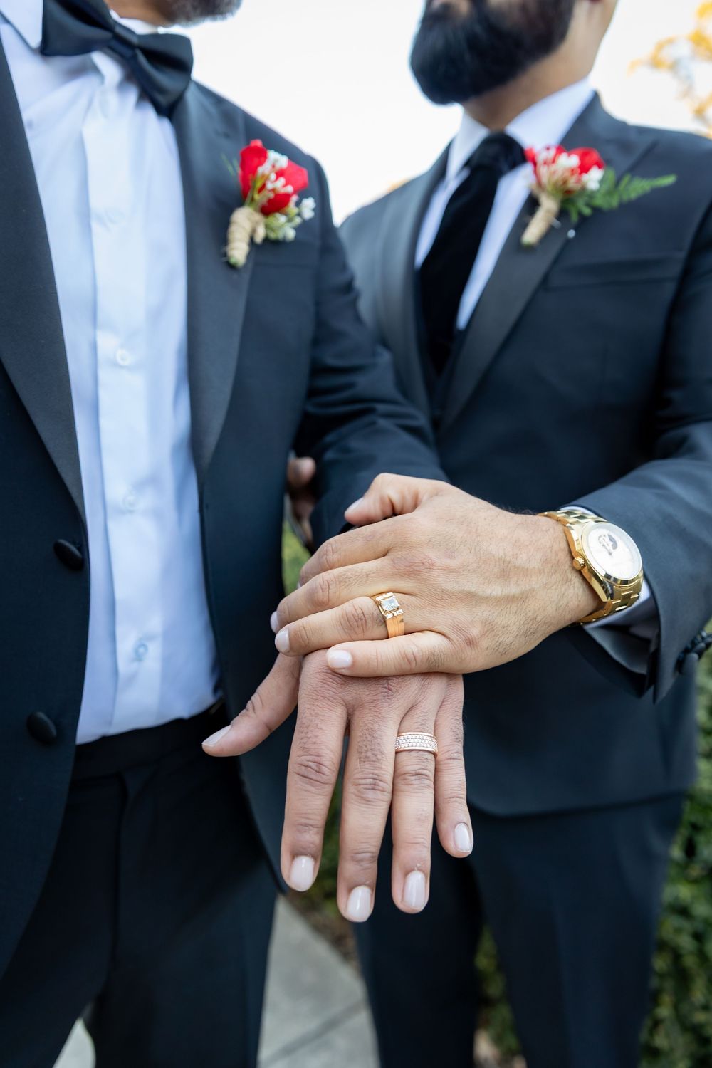 A series of close-up photos showing hands with wedding rings and boutonnieres against black formal attire.