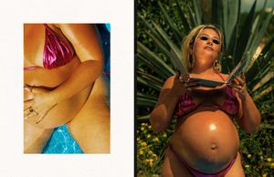 Close-up of a pregnant woman's belly in an outdoor garden setting with natural sunlight and foliage.