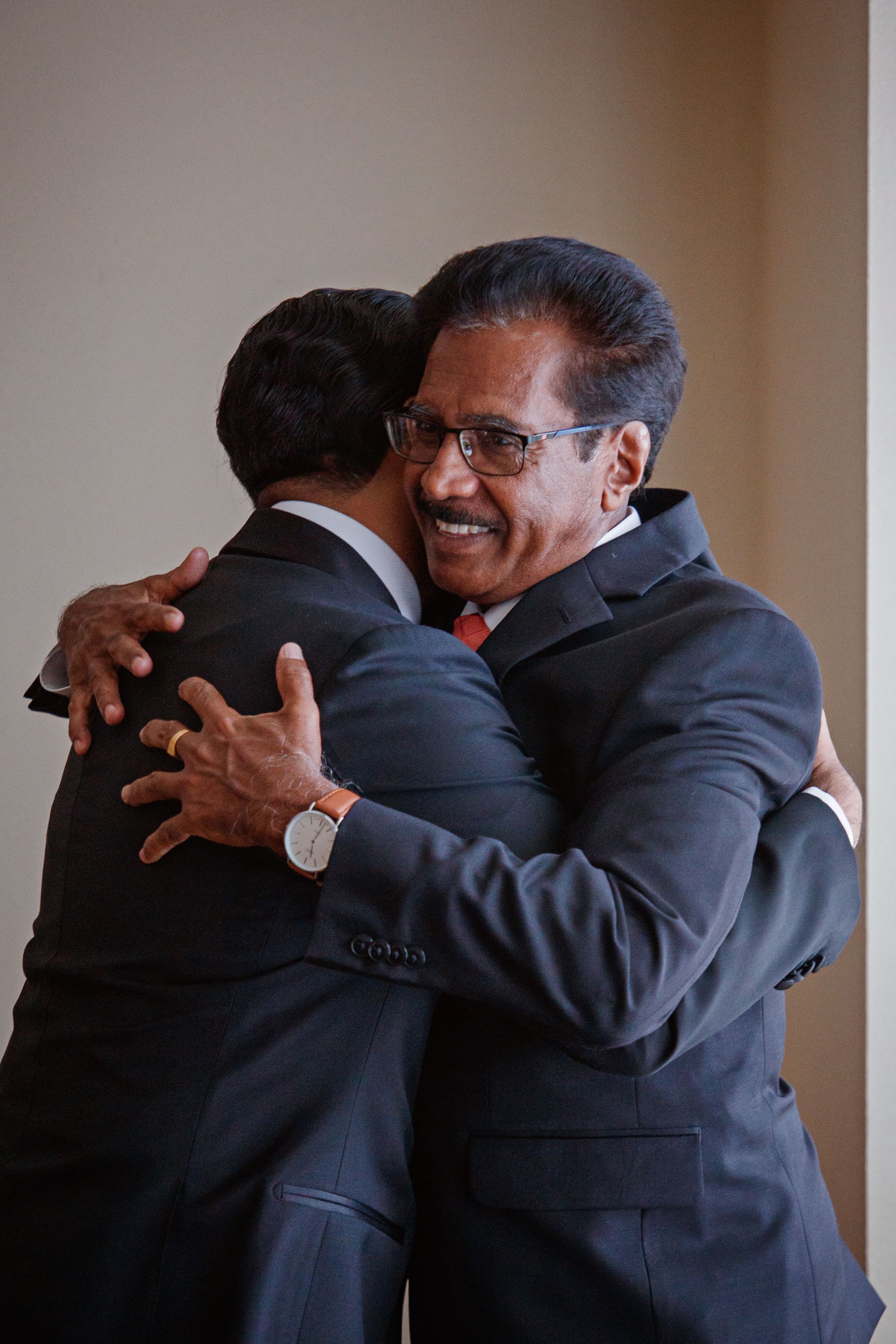 groom with father getting ready before ceremony