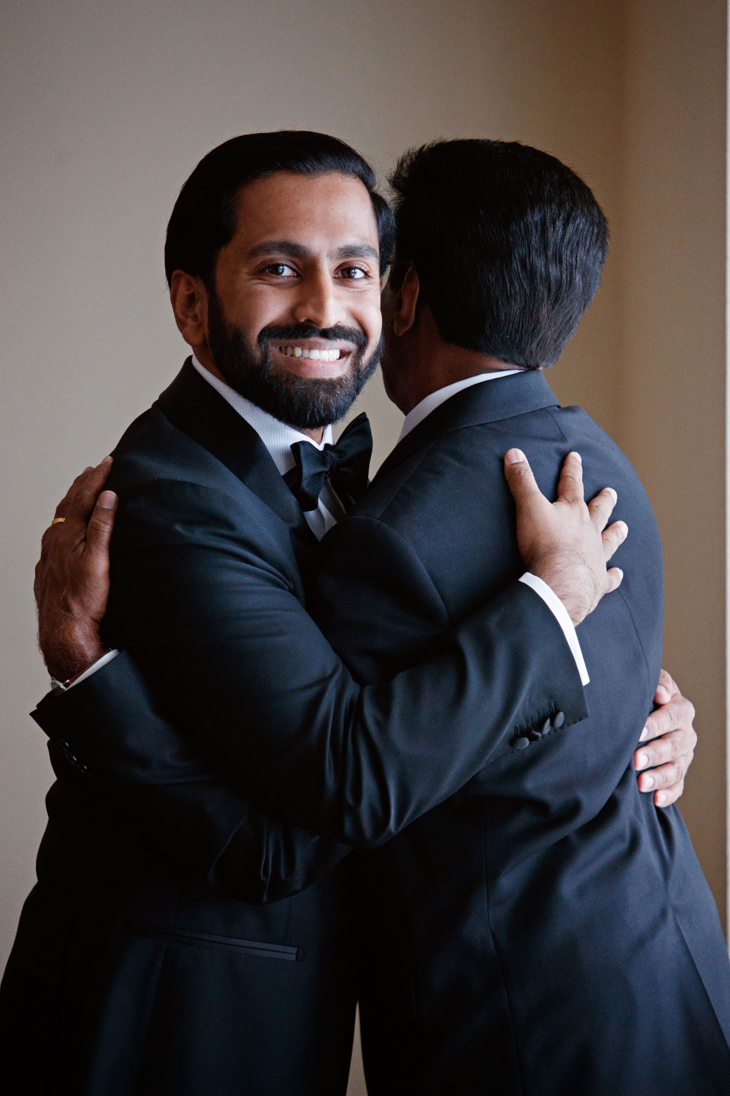 groom with father getting ready before ceremony