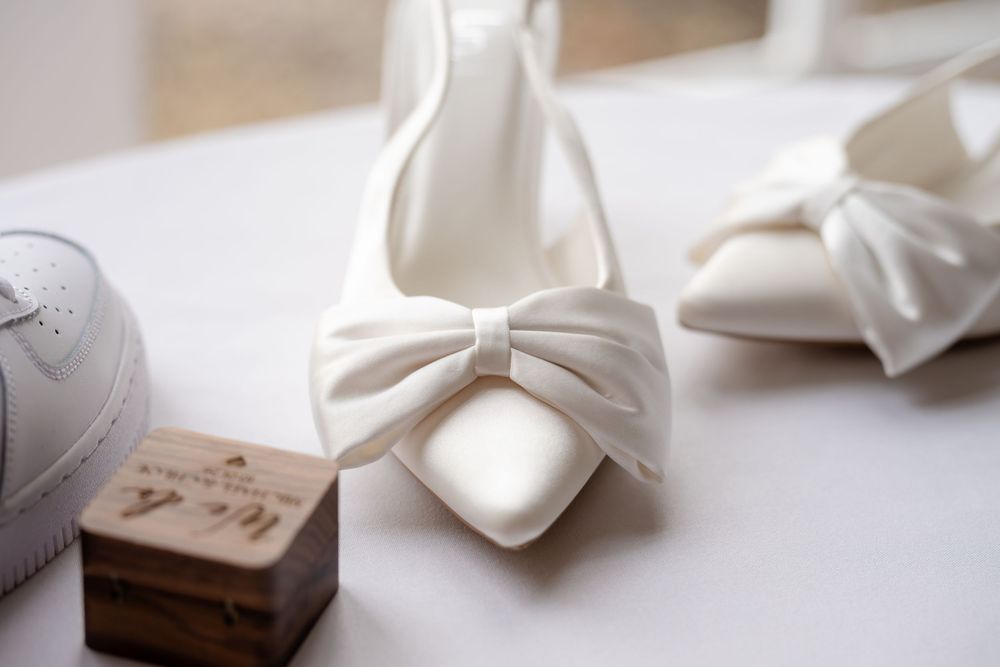 Crisp white folded napkins arranged in a neat row on a light surface creating an elegant table setting display.