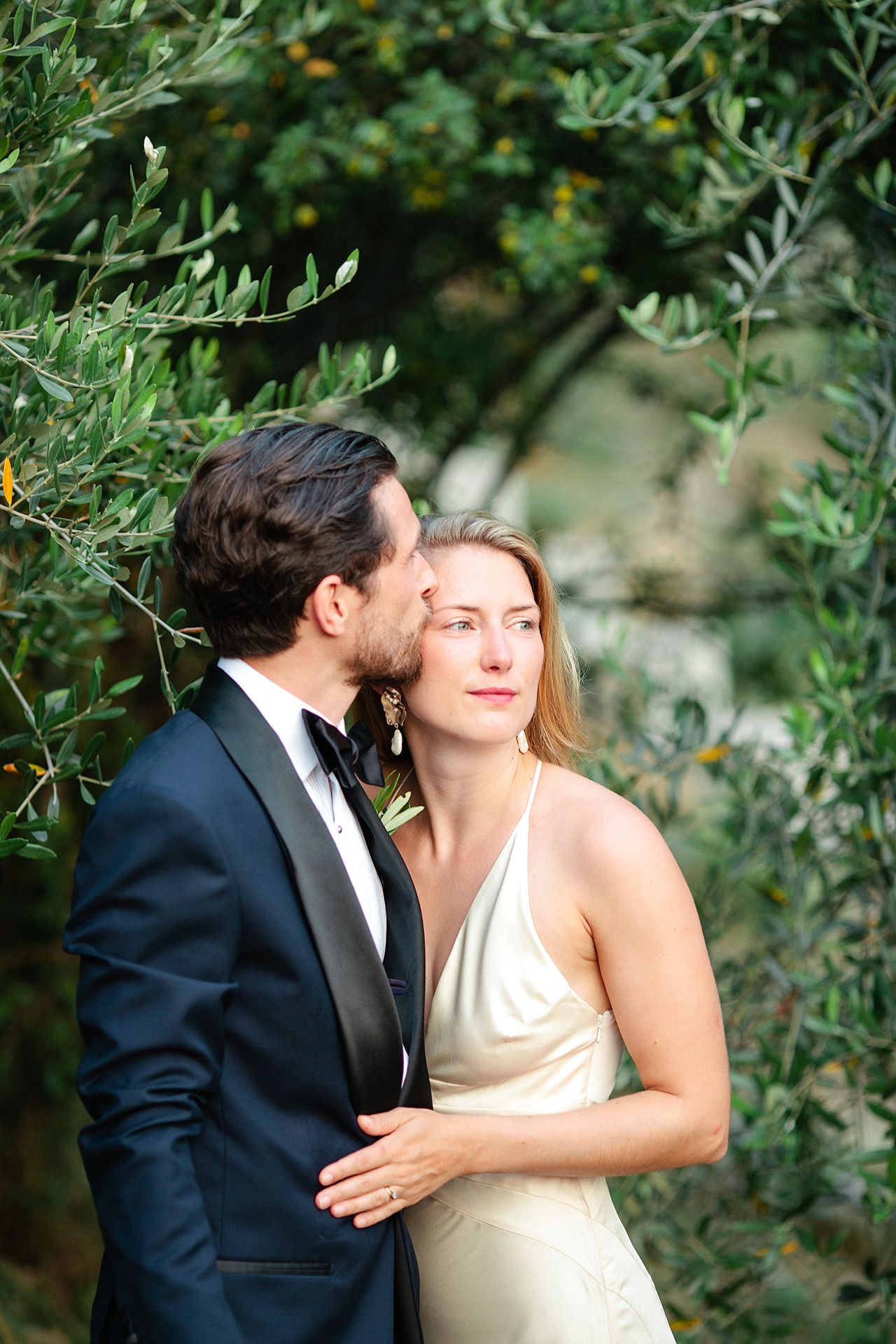 Bride and groom portrait in an olive garden during a Riviera destination wedding