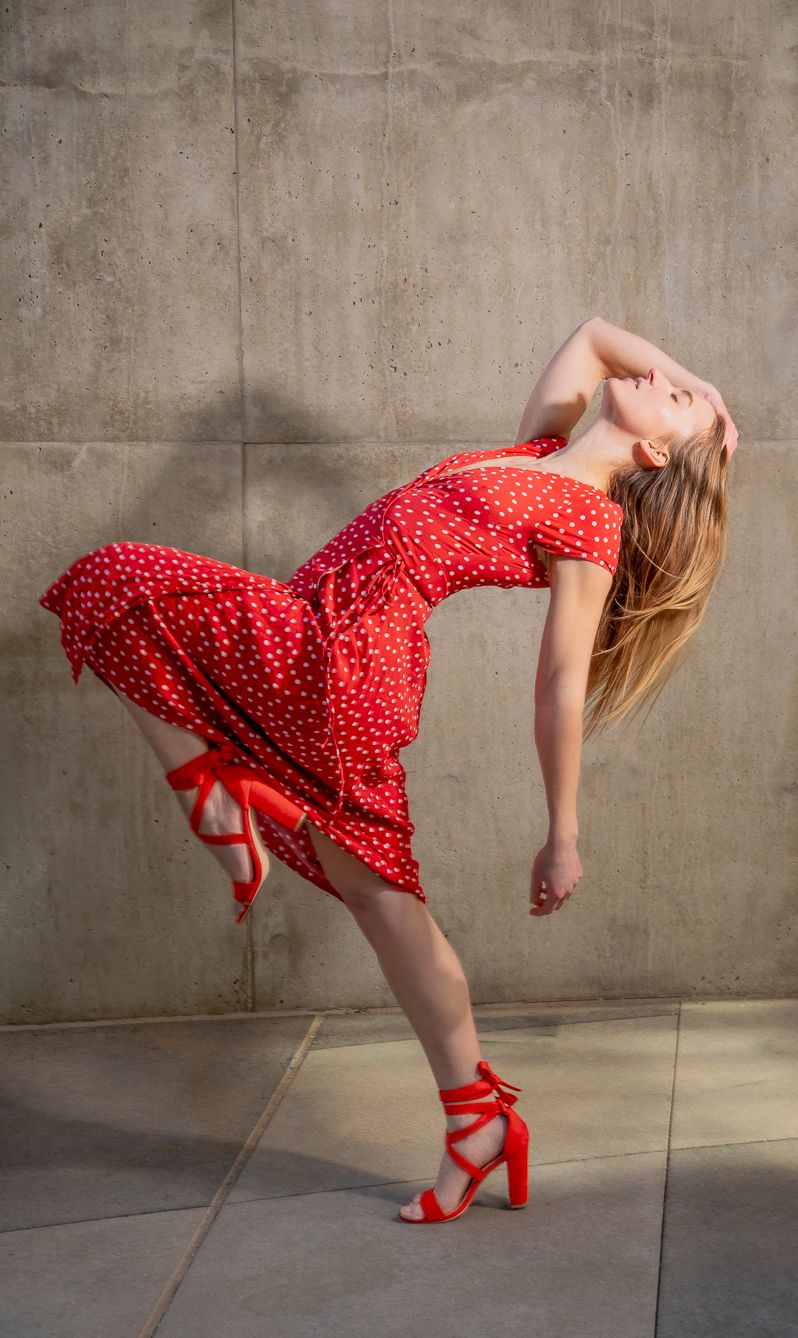 Portrait photography featuring a model in a red dress and red heels, created by commercial photographer Chris Z of Zeng Studio.