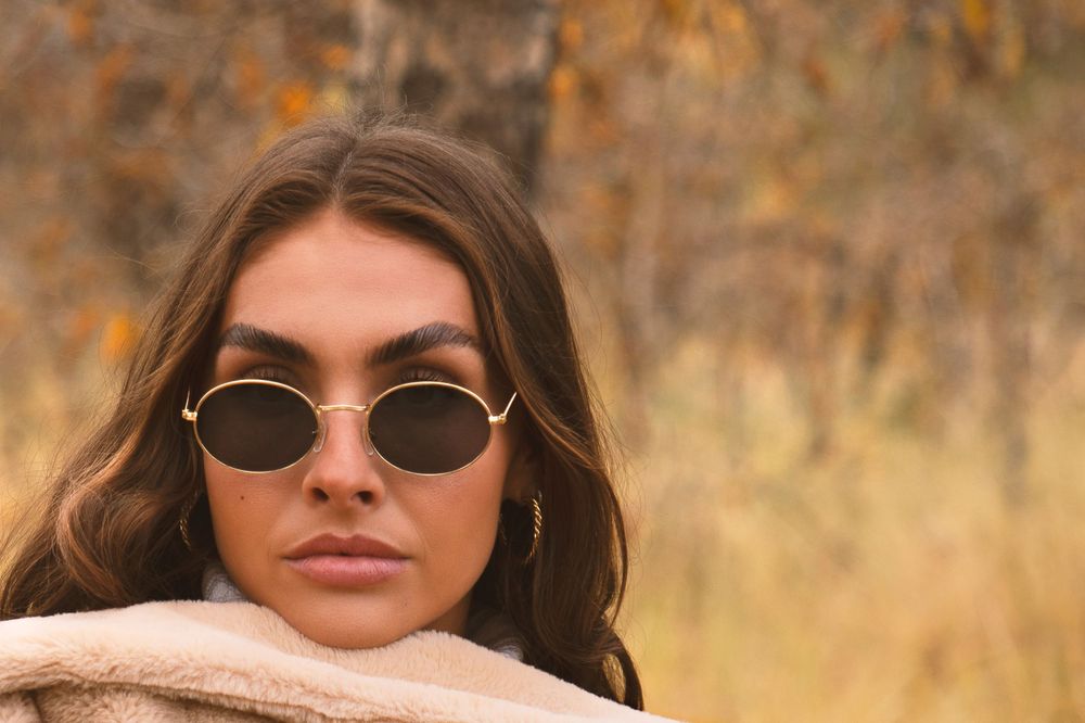 Headshot photography featuring a woman wearing sunglasses, created by commercial photographer Chris Z of Zeng Studio.