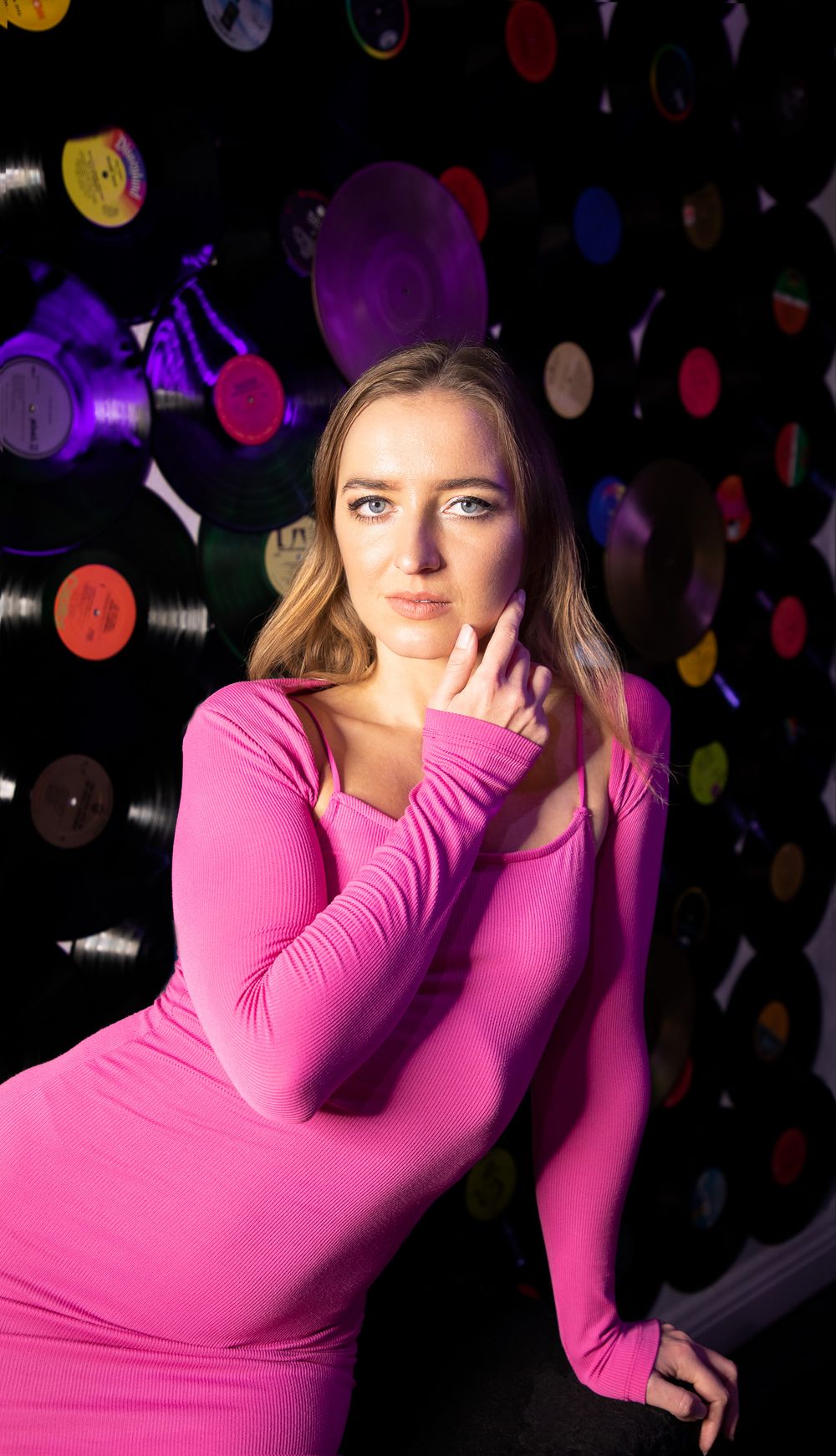 Portrait photography featuring a woman posing in a pink dress, created by commercial photographer Chris Z of Zeng Studio.