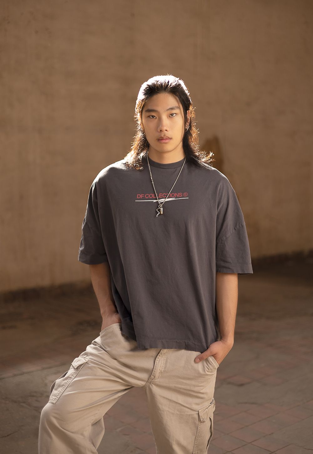 Lifestyle portrait photography featuring a model posing in streetwear, created by commercial photographer Chris Z of Zeng Studio.