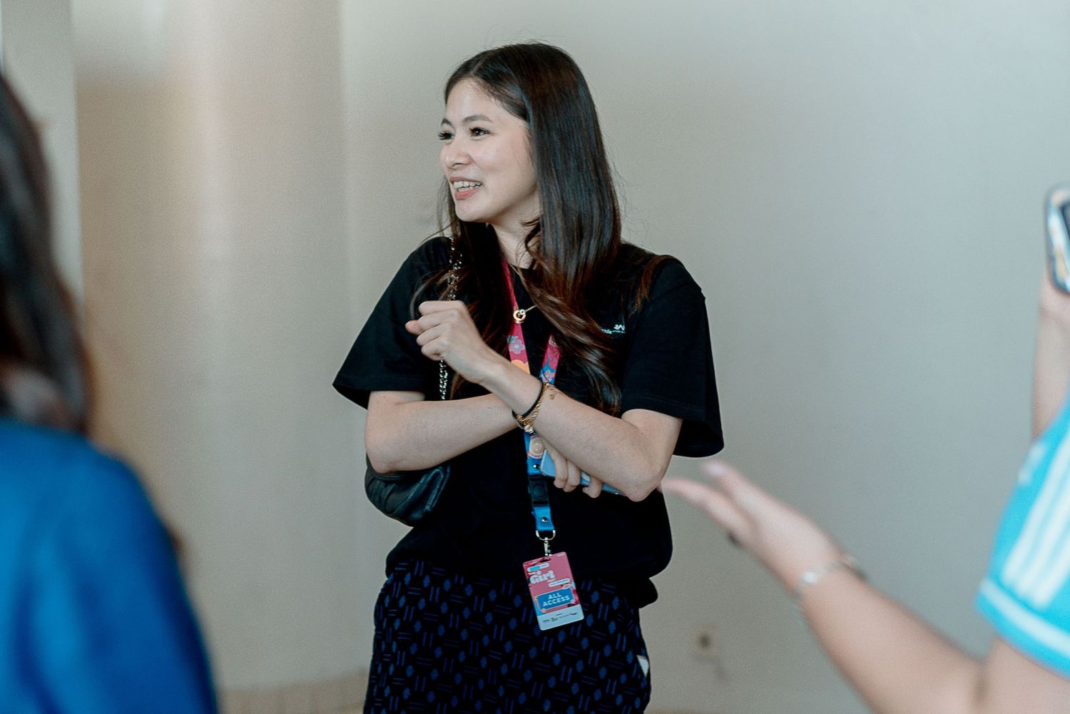 A sequence of photos showing someone in a black shirt gesturing while giving a presentation or speech.