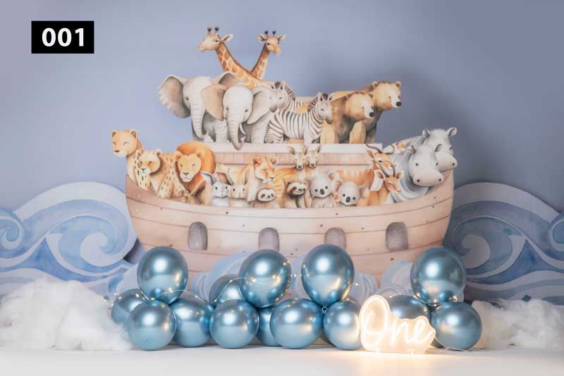 Noah's Ark themed backdrop with blue balloons and wooden toy animals.