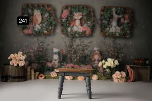 Floral photography backdrop with vintage furniture and soft lighting for portrait sessions.