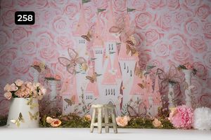 Whimsical princess castle backdrop with pink roses and decorative elements for photography.