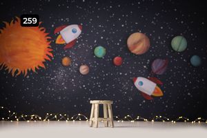 Space themed backdrop with planets, rockets, and stars perfect for children's photography.