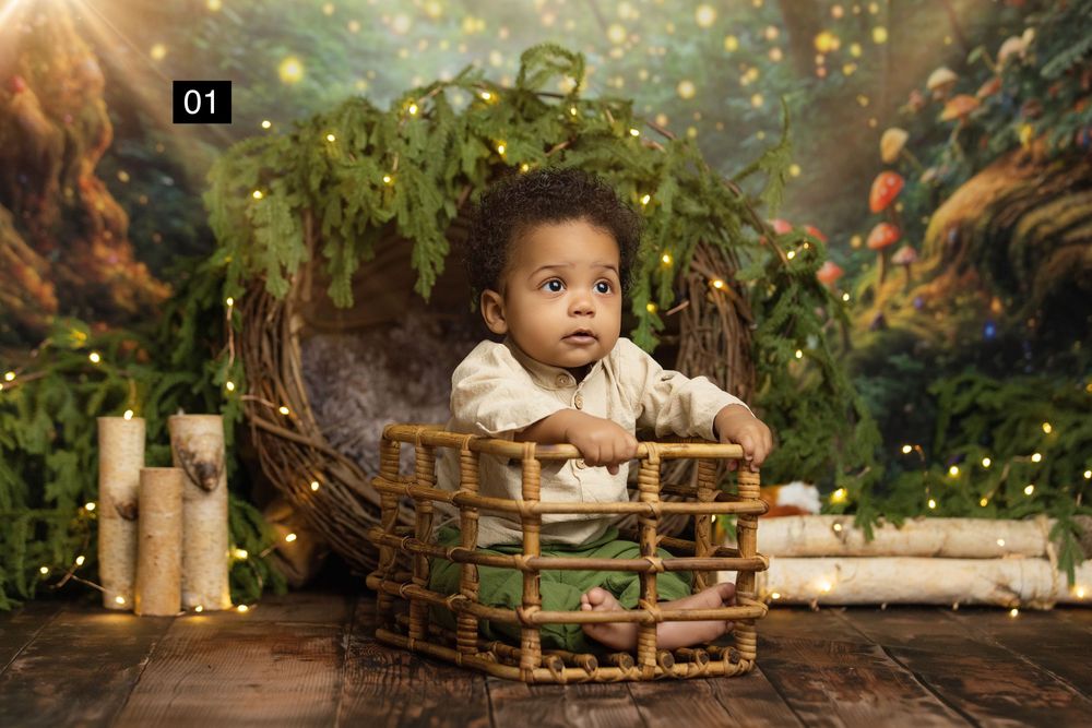 A baby sits in a wicker basket surrounded by fairy lights and greenery in an enchanted forest themed photo shoot.