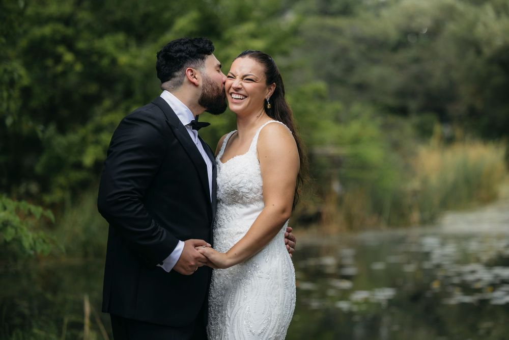 A couple in wedding attire shares romantic moments in Chicago Alfred Caldwell Lily Pool