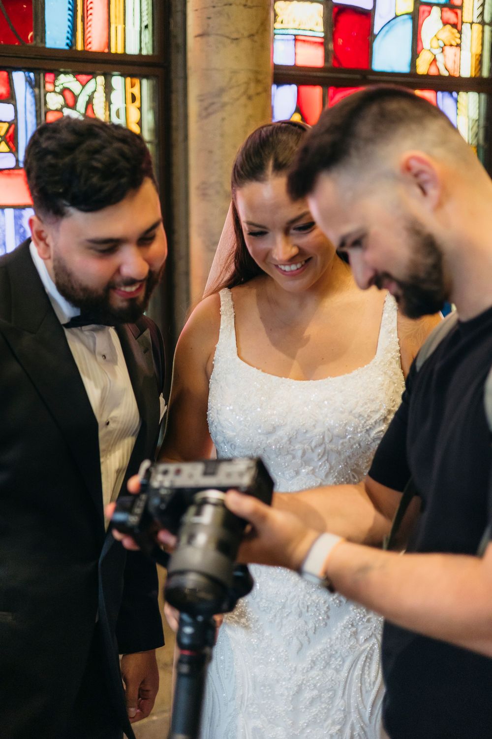 Chicago wedding videographer shows wedding couple shots on camera and they like it