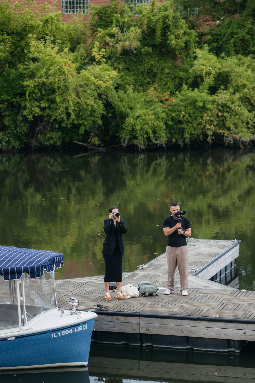 Chicago wedding photography and videography team working behind the scenes on a deck