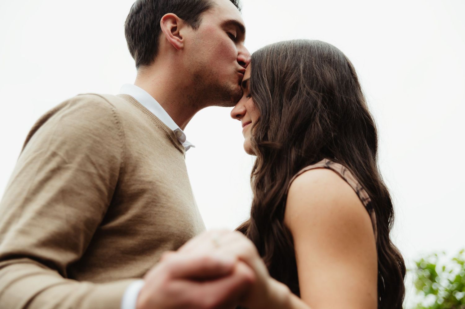 A romantic couple shares intimate moments in a series of black and white wedding photos.
