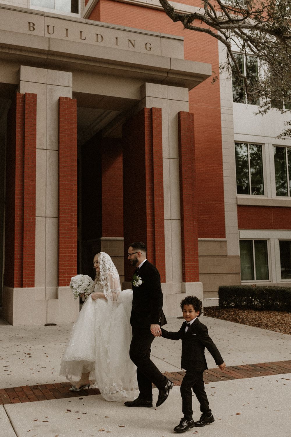 A sequence of playful wedding photos outside a brick building with white columns.