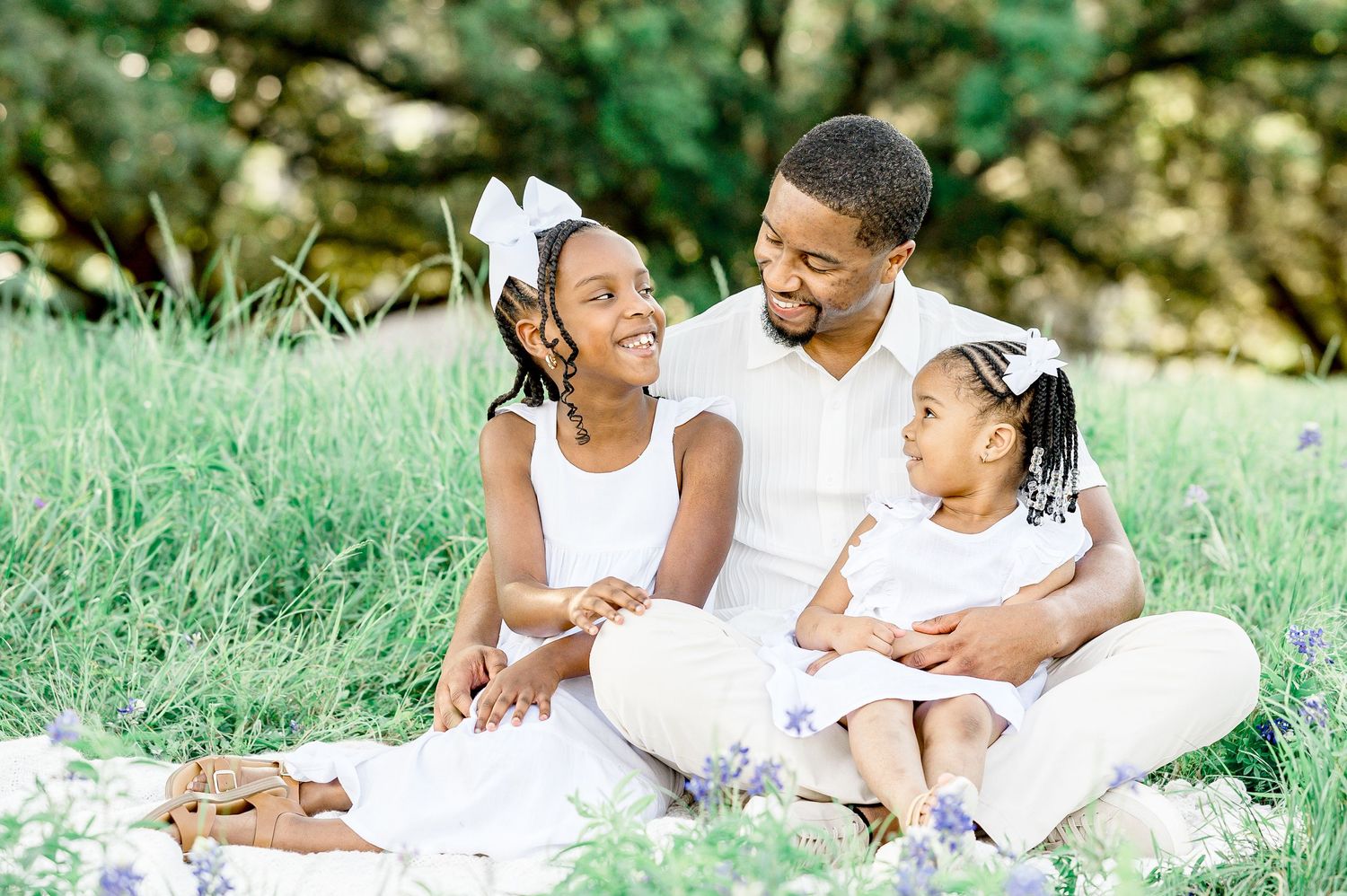 dad and daughter in a field of spring flowers