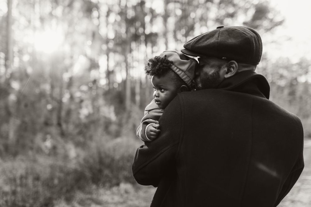 Black and white intimate portrait series with moody lighting.