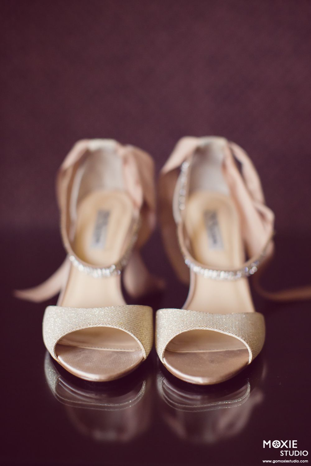 Elegant white bridal shoes with sparkly details shown in a progressive focus blur effect sequence.