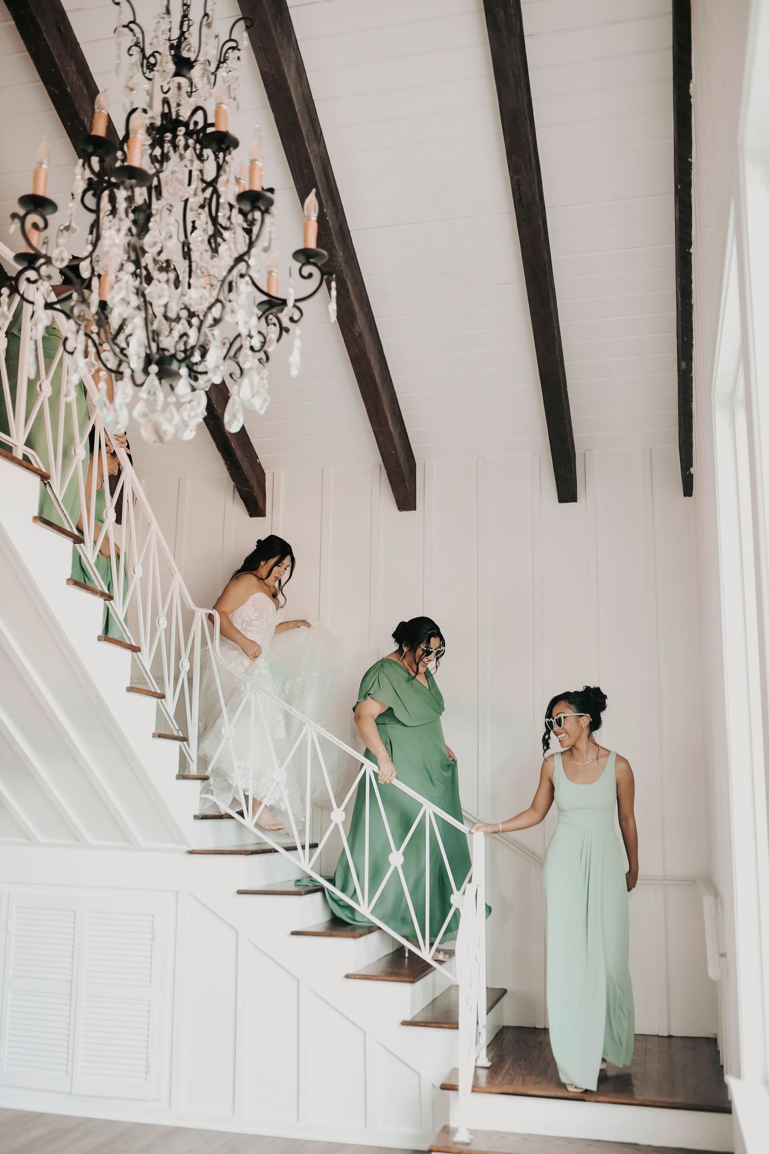 Sage green bridesmaids holding bouquets at Firefly Gardens wedding venue