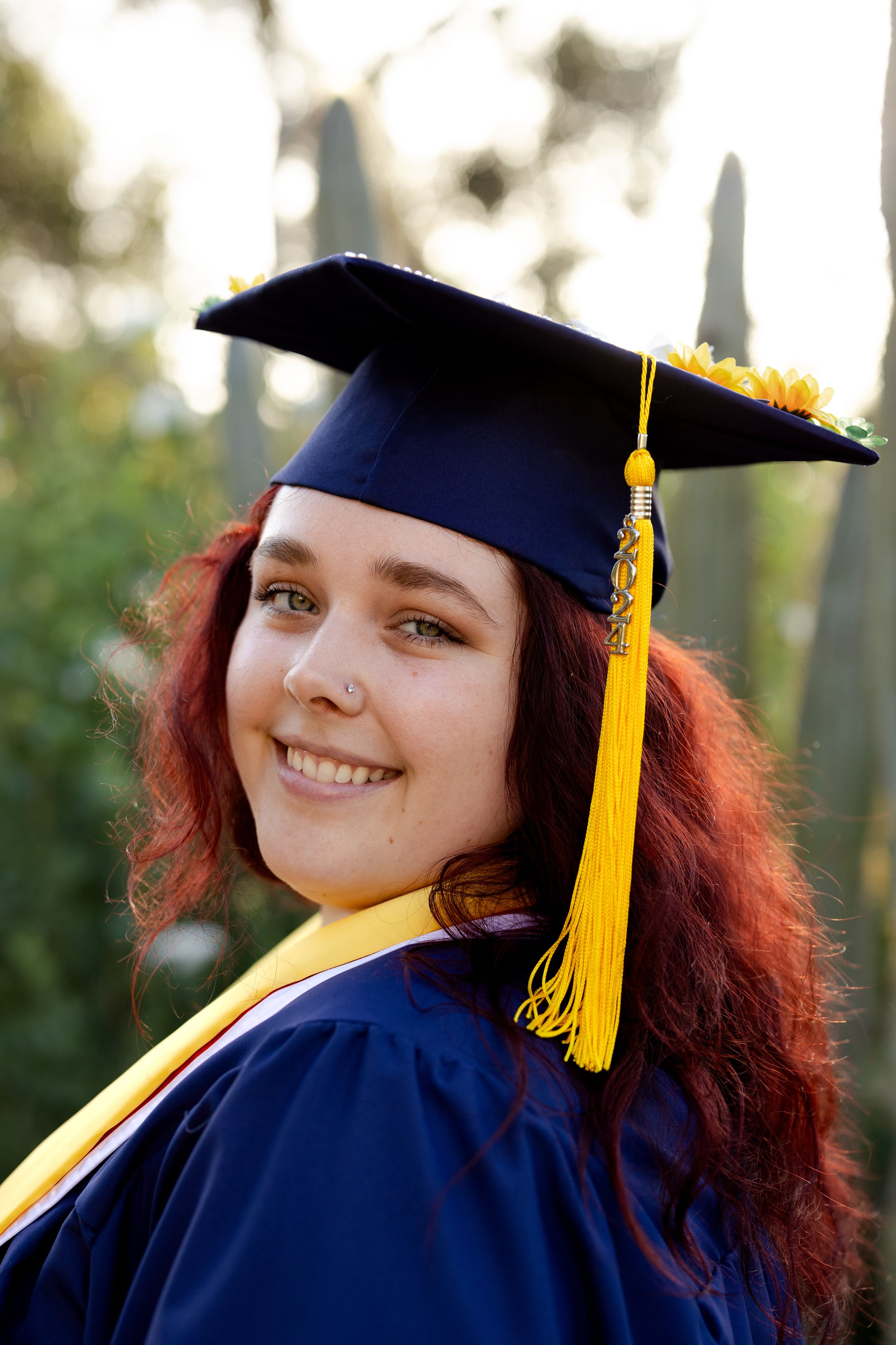 Candid moment during grad shoot in San Diego at Cactus Gardens Balboa Park. Modern senior pictures San Diego