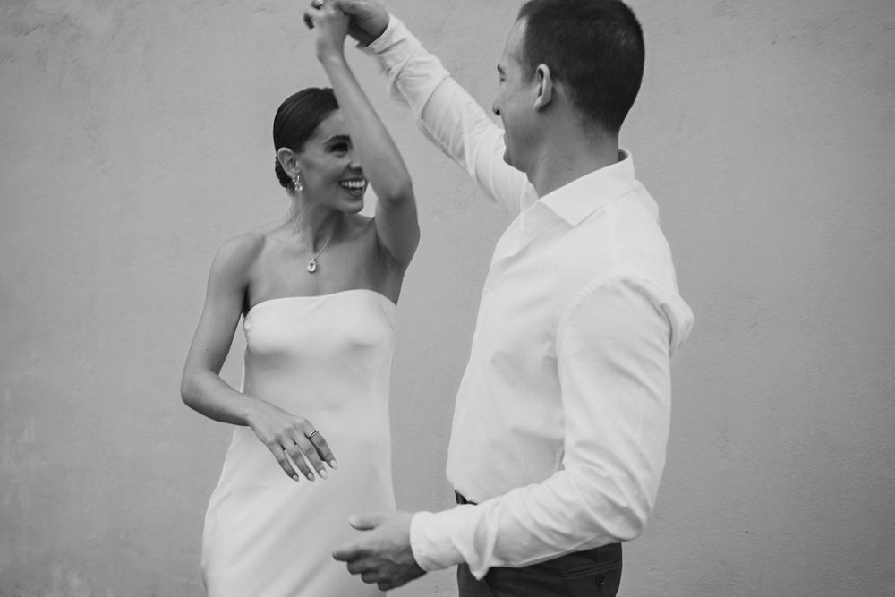 Dancing together, sharing a lighthearted and joyful moment