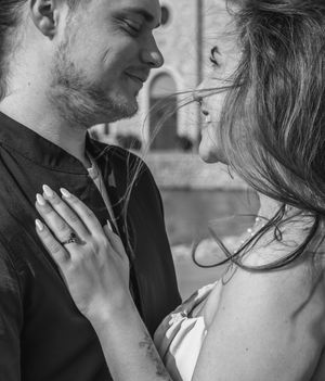 A romantic black and white photo series showing tender intimate moments between a couple in close proximity. Engagement session Fort Worth