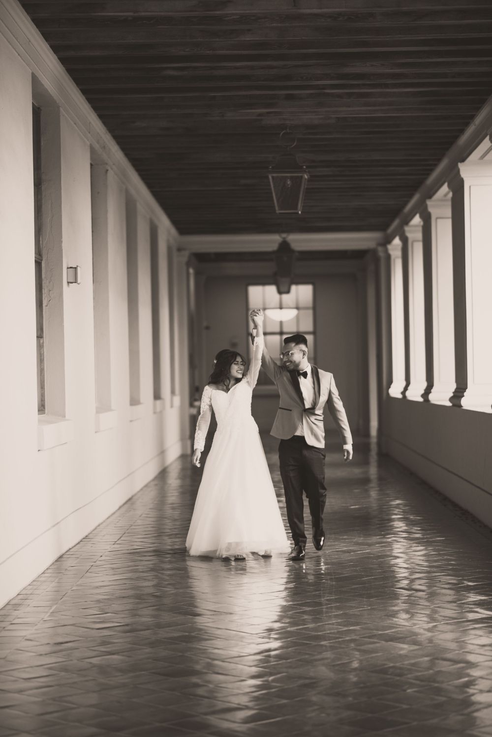 At Pasadena City Hall, the bride and groom exchange loving glances as they pose for their wedding photos.