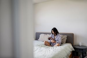 Peaceful bedroom scene with soft natural lighting and comfortable bedding.