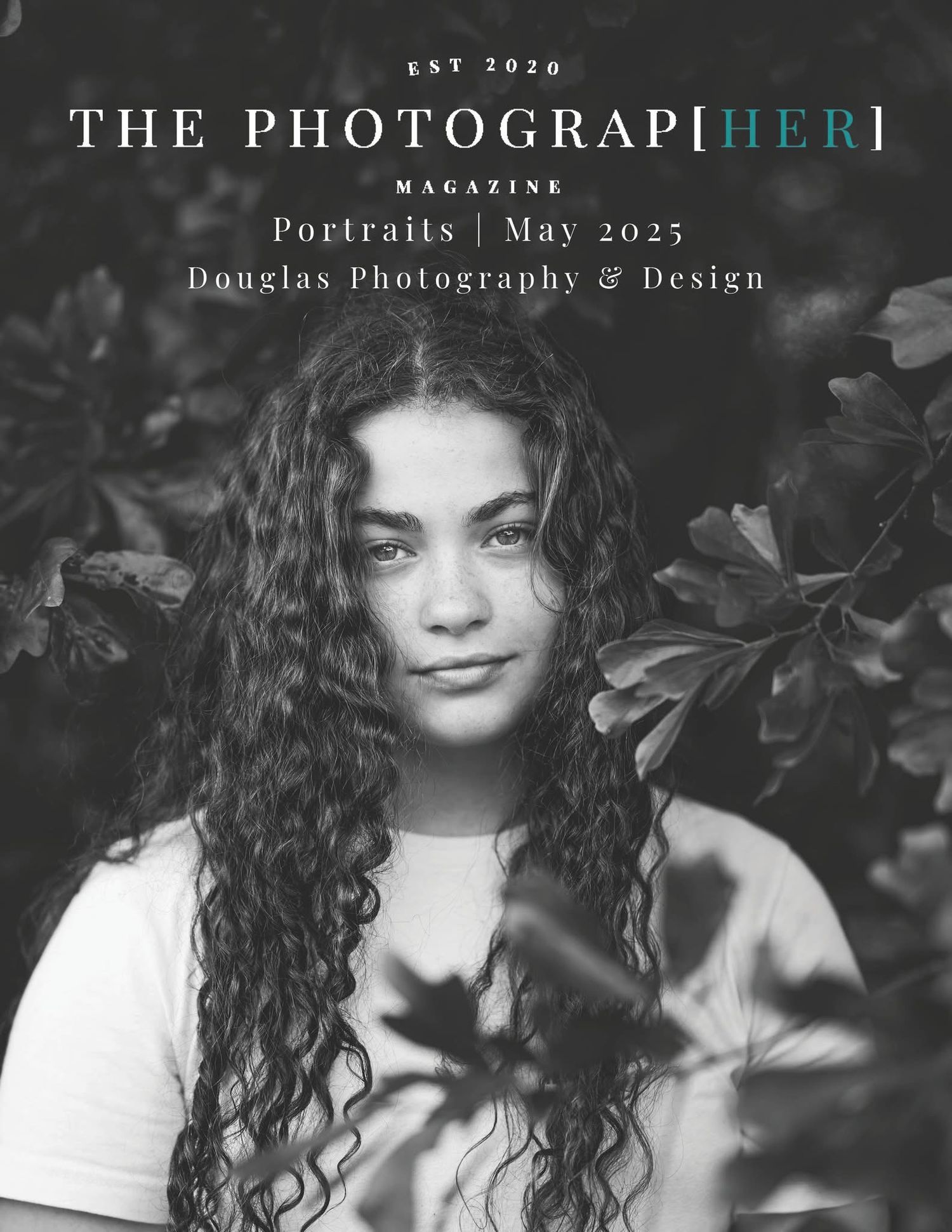 Black and white magazine cover of The Photographer magazine showing portrait with long curly hair against foliage background.