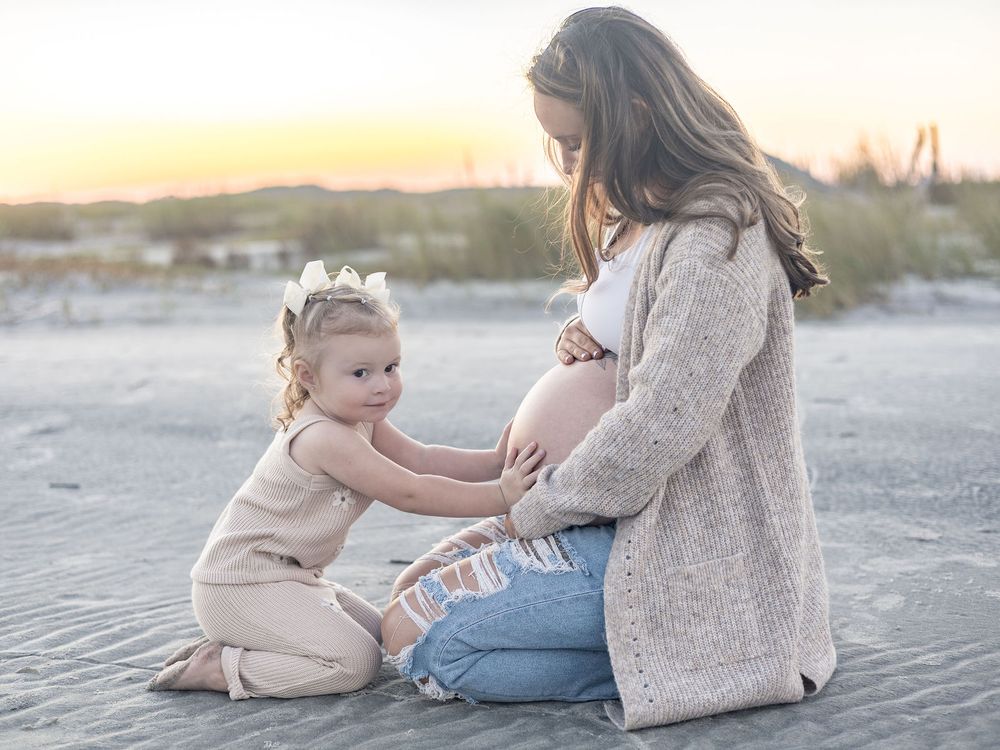 A touching series of beach photos showing tender moments between parent and child during golden hour.
