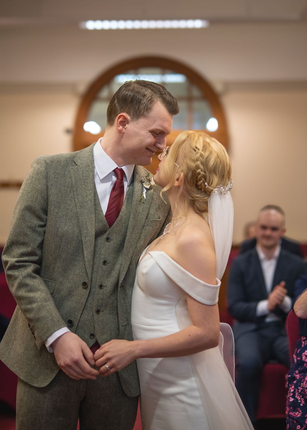 Sheffield Town Hall Wedding - Wedding ceremony moment in indoor venue with elegant decor.