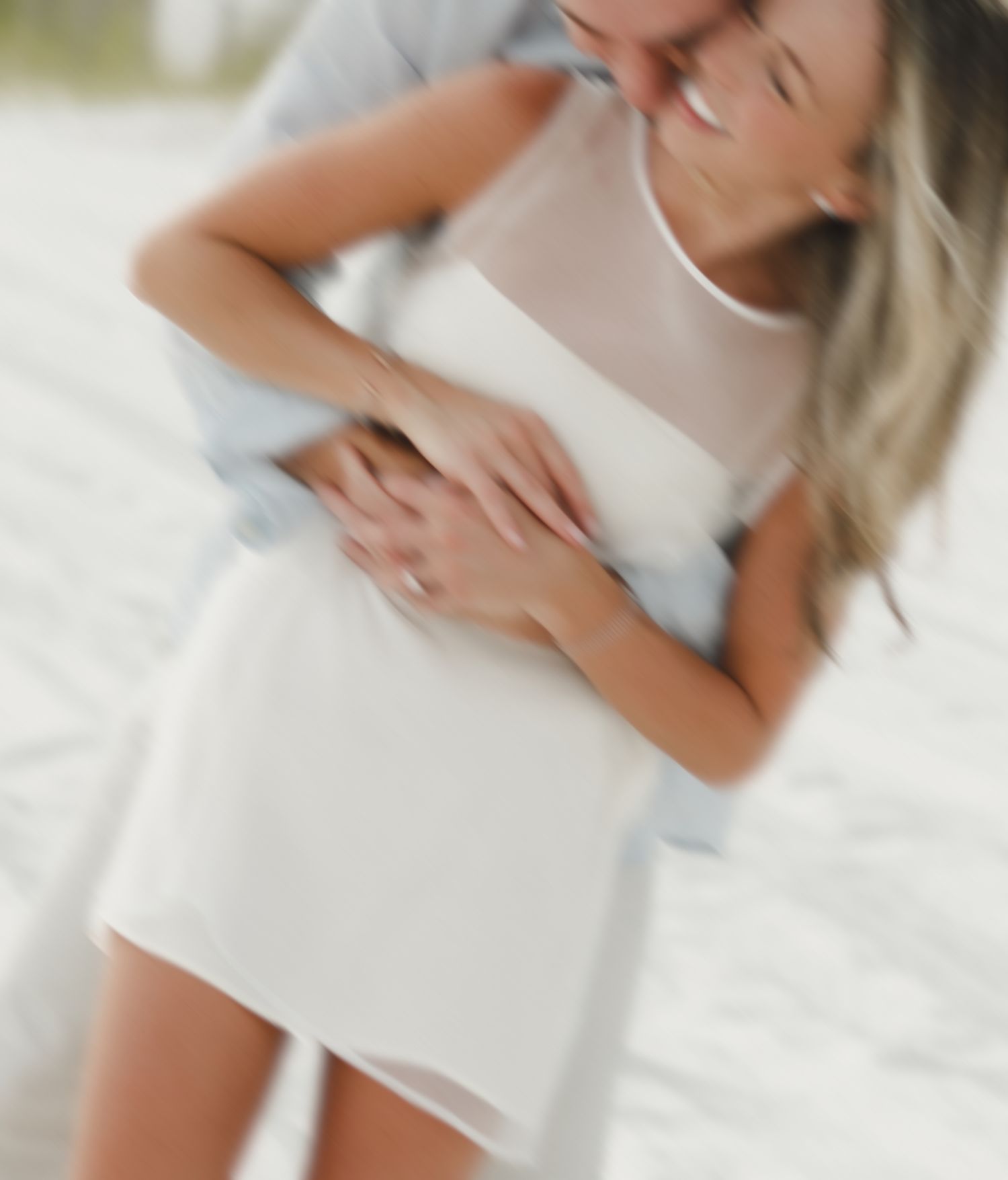 Close-up artistic shots of movement and fabric in white against light background.