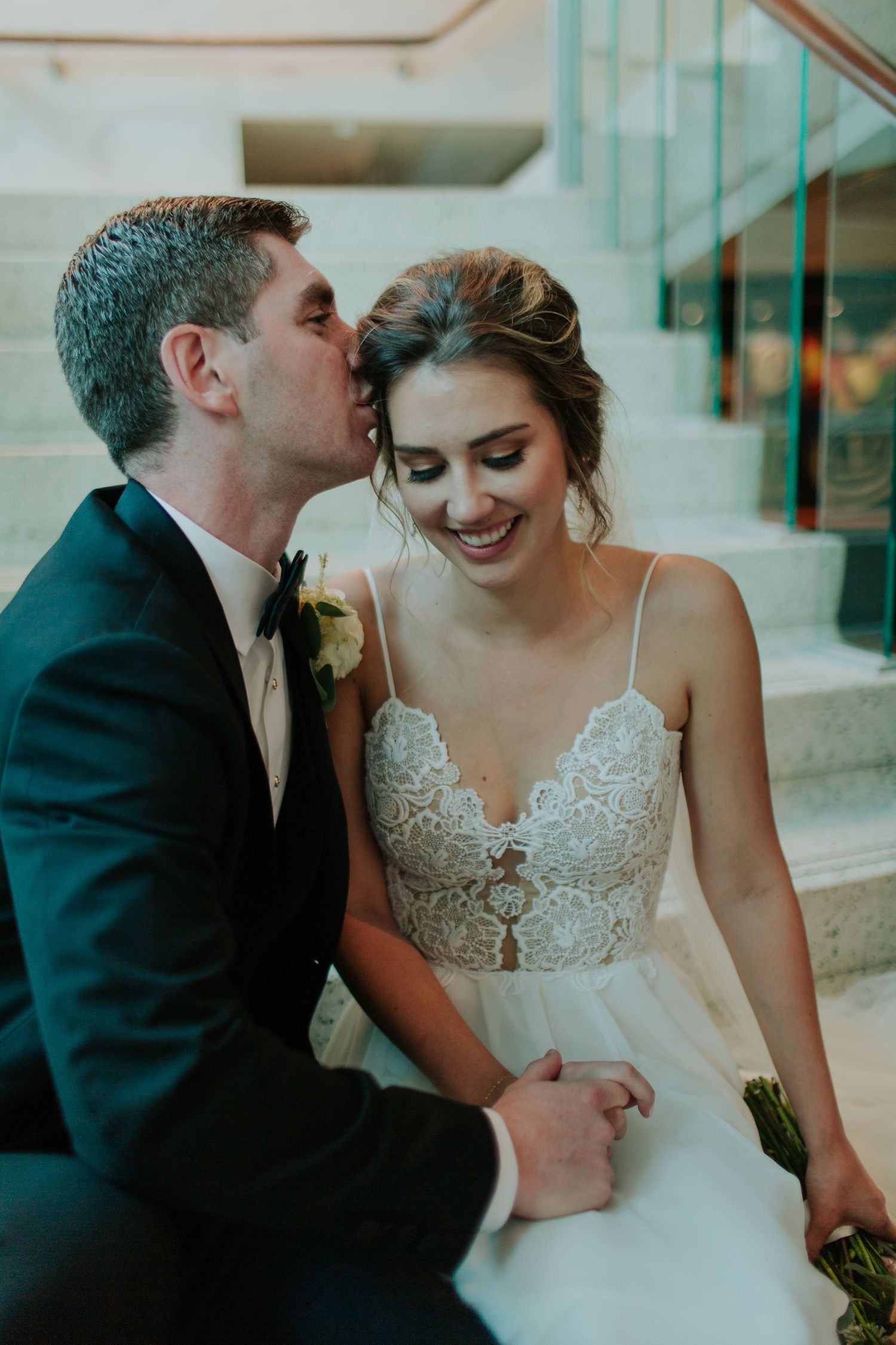 Intimate wedding moment captured in an elegant interior setting.