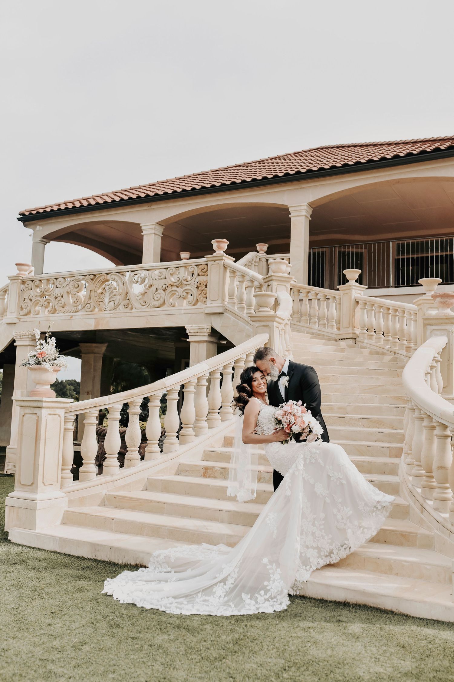 bride and groom walk down the Tuscan Staircase of D'Vine Grace Vineyard after their sunset wedding ceremony in McKinney Texas