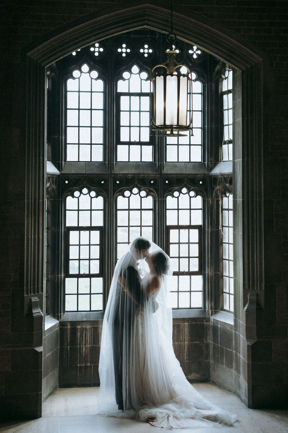 Elegant indoor wedding photography at Hart House in Toronto, capturing romantic moments.