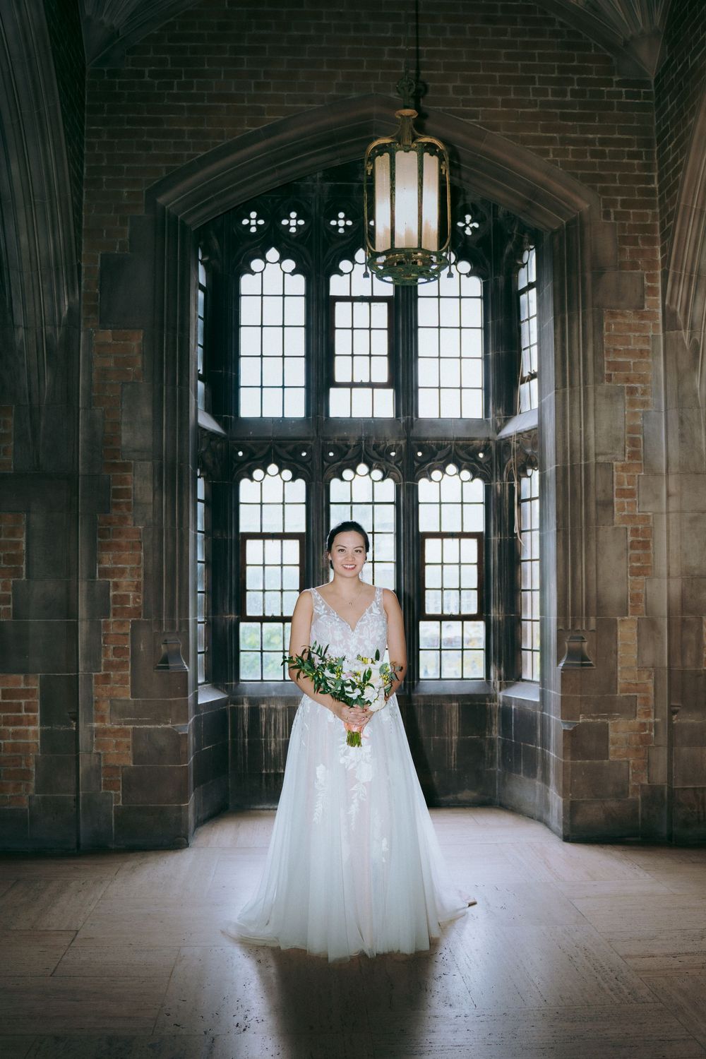 Elegant indoor wedding photography at Hart House in Toronto, capturing romantic moments.
