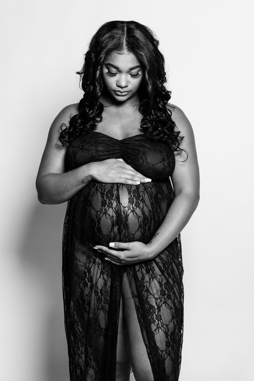 "Expectant mother glowing in natural light maternity portrait"